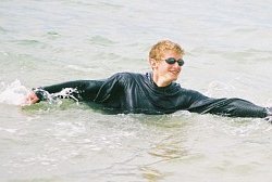 surf swimming in a hoodie