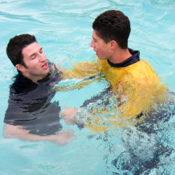 lifeguard in the water with clothes