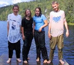 lifesaving class outdoors lake swimming in clothes